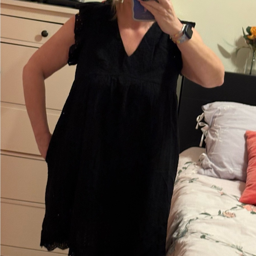 Sleeveless Black Mini Dress with V-Neck and Lace Accents